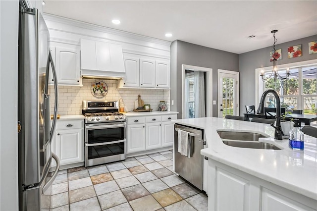 1112 N Oriole Ave, Rogers, AR 72756 - kitchen with stainless steel appliances, premium range hood, light countertops, decorative backsplash, and white cabinetry
