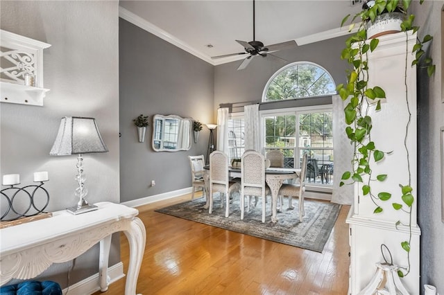 1112 N Oriole Ave, Rogers, AR 72756 - dining room with ornamental molding, a ceiling fan, and wood finished floors