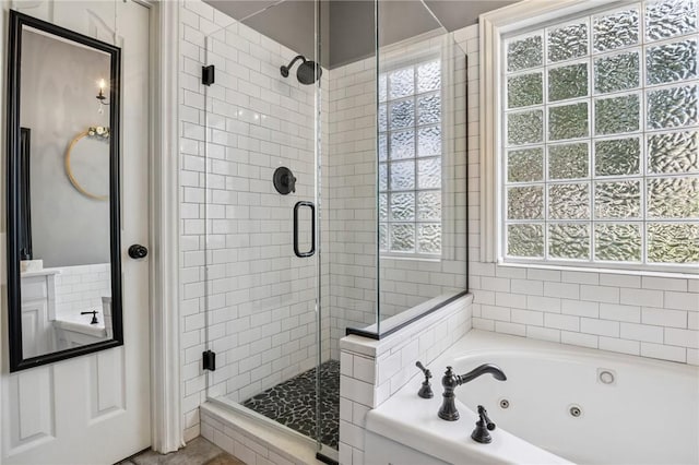 1112 N Oriole Ave, Rogers, AR 72756 - bathroom featuring a stall shower and a jetted tub