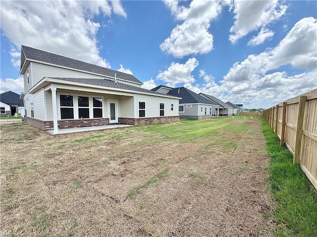 6003 SW Desert Ave, Bentonville, AR 72713 - rear view of property with brick siding