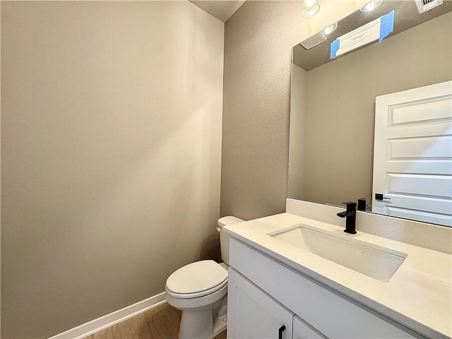 6003 SW Desert Ave, Bentonville, AR 72713 - half bath with vanity and wood finished floors