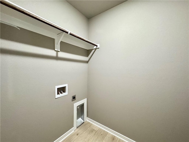6003 SW Desert Ave, Bentonville, AR 72713 - washroom featuring hookup for an electric dryer, washer hookup, and light wood-style flooring