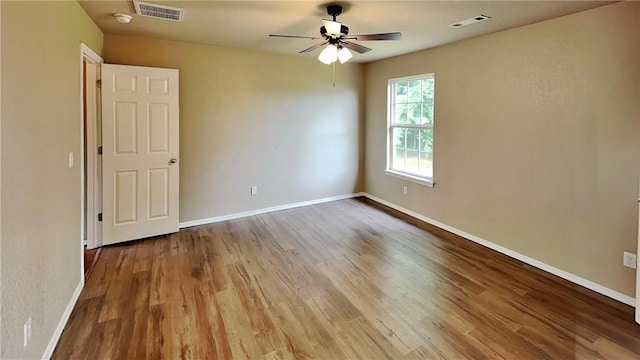 3107 SW Wentworth Ave, Bentonville, AR 72713 - spare room with a ceiling fan, wood finished floors, and a smoke detector