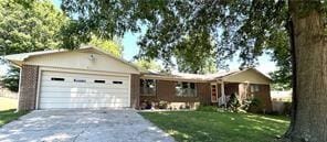 411 Natchez Trace St, Harrison, AR 72601 - single story home featuring an attached garage, concrete driveway, and a front yard