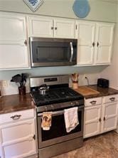 411 Natchez Trace St, Harrison, AR 72601 - kitchen with appliances with stainless steel finishes, white cabinets, and dark countertops