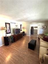411 Natchez Trace St, Harrison, AR 72601 - living area featuring wood finished floors and baseboards