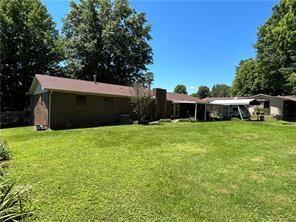 411 Natchez Trace St, Harrison, AR 72601 - back of house featuring a yard