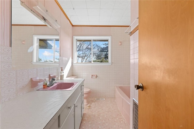 12158 E 62nd Hwy, Harrison, AR 72601 - bathroom with vanity, tile patterned floors, crown molding, and tile walls