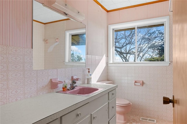 12158 E 62nd Hwy, Harrison, AR 72601 - bathroom featuring vanity, crown molding, and tile walls
