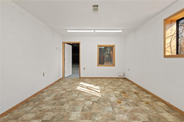 12158 E 62nd Hwy, Harrison, AR 72601 - spare room with baseboards and stone finish flooring