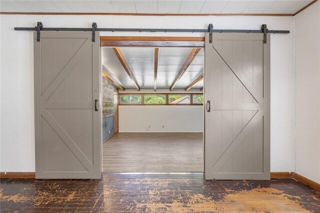 702 E Argyle, Harrison, AR 72601 - hall with a barn door and wood-type flooring