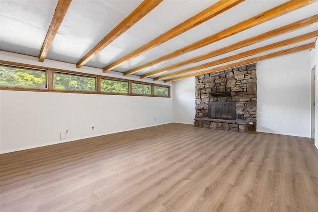 702 E Argyle, Harrison, AR 72601 - unfurnished living room with wood finished floors and a fireplace