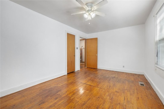 702 E Argyle, Harrison, AR 72601 - empty room featuring wood finished floors and a ceiling fan