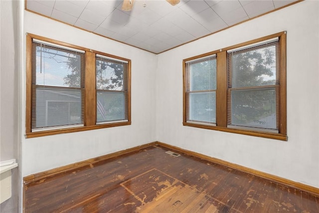 702 E Argyle, Harrison, AR 72601 - unfurnished room with hardwood / wood-style flooring and baseboards