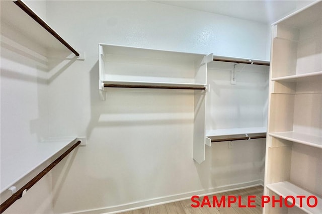 5906 SW Chiefs Rd, Bentonville, AR 72713 - spacious closet with wood finished floors
