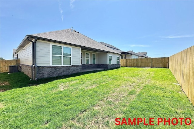 5906 SW Chiefs Rd, Bentonville, AR 72713 - rear view of property featuring brick siding and a fenced backyard