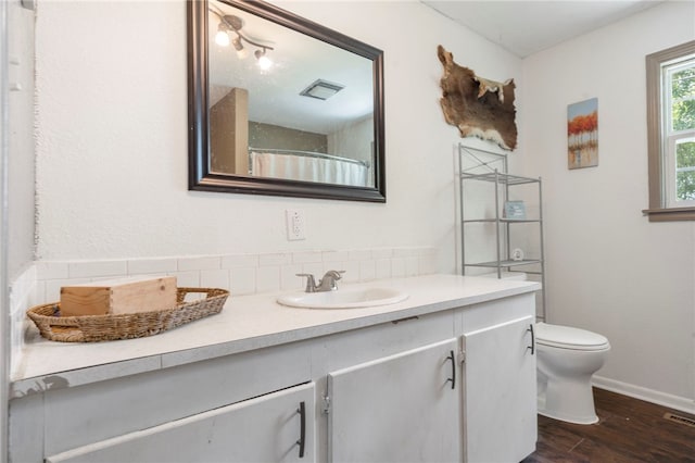 9402 Stone Ln, Omaha, AR 72662 - full bath featuring vanity, wood finished floors, and a shower with shower curtain