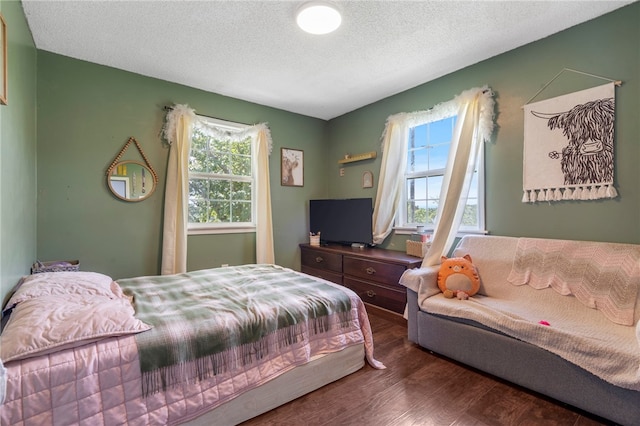 9402 Stone Ln, Omaha, AR 72662 - bedroom with wood finished floors and a textured ceiling