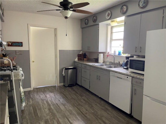 315 Glines Ct, Harrison, AR 72601 - kitchen featuring white appliances, ceiling fan, a textured ceiling, a wainscoted wall, and dark wood-style flooring