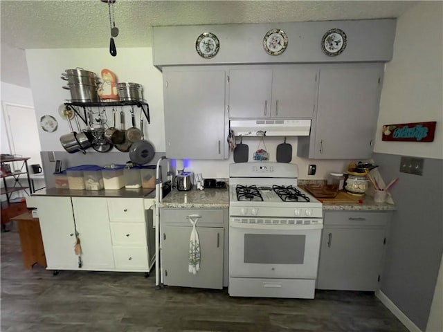 315 Glines Ct, Harrison, AR 72601 - kitchen featuring white gas range, under cabinet range hood, a textured ceiling, and light countertops