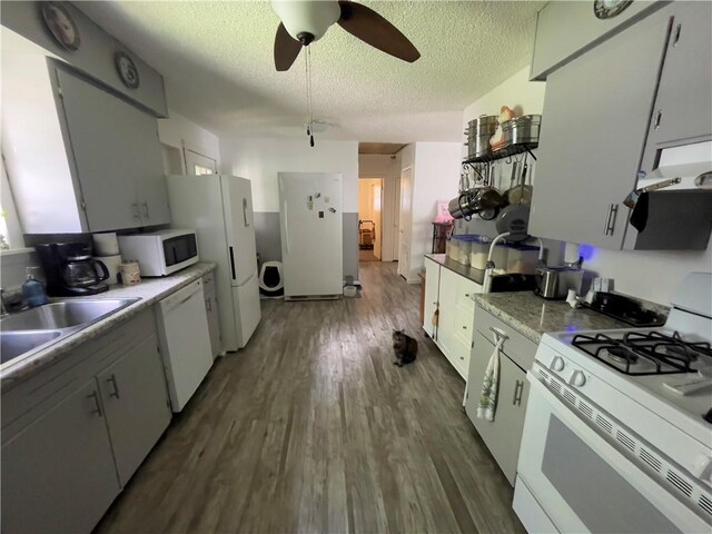 315 Glines Ct, Harrison, AR 72601 - kitchen featuring white appliances, dark wood-style flooring, a textured ceiling, ceiling fan, and under cabinet range hood