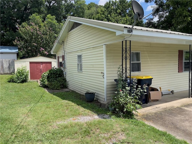 315 Glines Ct, Harrison, AR 72601 - view of side of home featuring a storage unit
