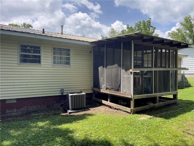 315 Glines Ct, Harrison, AR 72601 - rear view of house featuring a lawn, crawl space, a sunroom, and a metal roof
