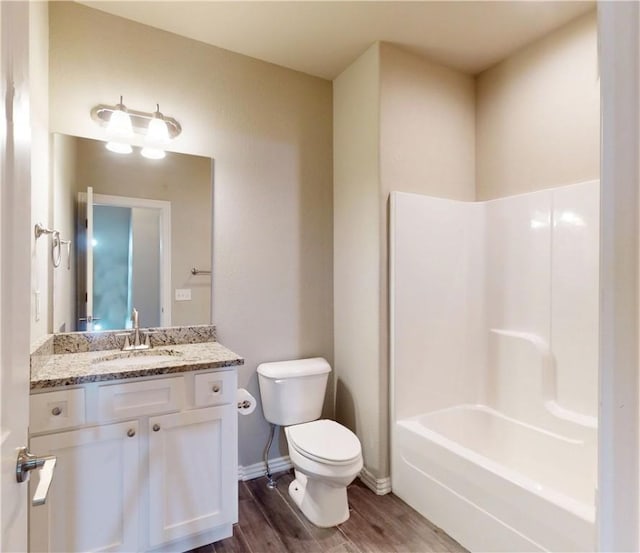1218 Bradley St, Centerton, AR 72719 - bathroom with wood finished floors, vanity, and washtub / shower combination