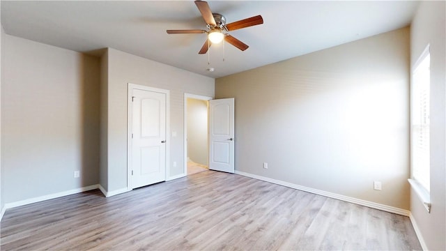 1218 Bradley St, Centerton, AR 72719 - unfurnished bedroom with light wood-style floors and ceiling fan