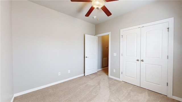 1218 Bradley St, Centerton, AR 72719 - unfurnished bedroom featuring light colored carpet, a closet, and ceiling fan