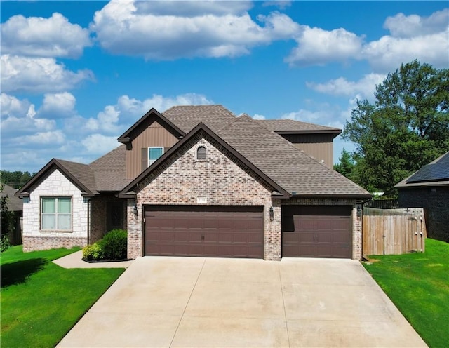 1218 Bradley St, Centerton, AR 72719 - craftsman-style house featuring an attached garage, driveway, brick siding, board and batten siding, and a shingled roof