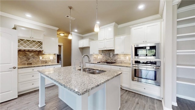 1218 Bradley St, Centerton, AR 72719 - kitchen featuring stainless steel appliances, crown molding, white cabinetry, recessed lighting, and tasteful backsplash