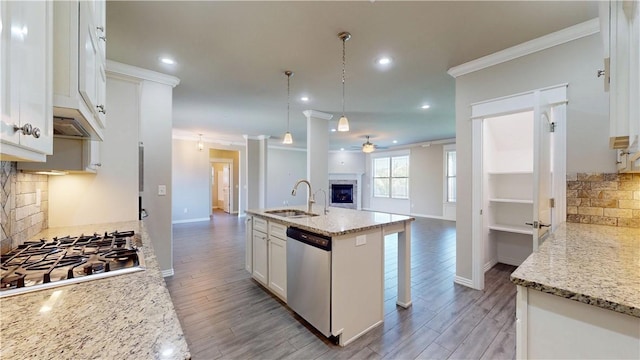 1218 Bradley St, Centerton, AR 72719 - kitchen featuring appliances with stainless steel finishes, open floor plan, ornamental molding, ceiling fan, and tasteful backsplash