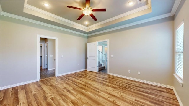 1218 Bradley St, Centerton, AR 72719 - unfurnished bedroom with light wood finished floors, a raised ceiling, ornamental molding, and ceiling fan