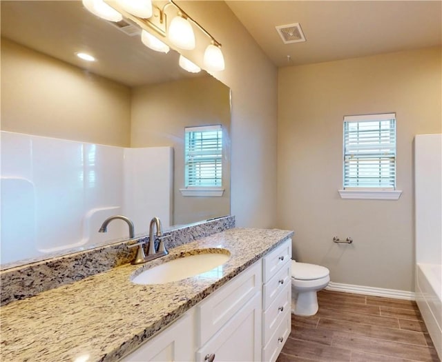 1218 Bradley St, Centerton, AR 72719 - bathroom with vanity, healthy amount of natural light, and wood finished floors