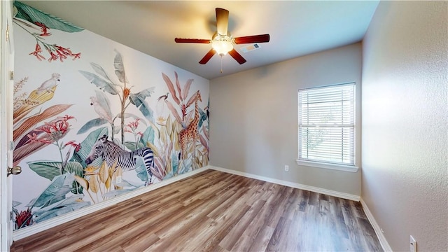 1218 Bradley St, Centerton, AR 72719 - spare room with wood finished floors and ceiling fan