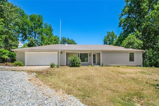 15654 Hickory Ln, Lowell, AR 72745 - single story home featuring gravel driveway, a garage, and a front yard