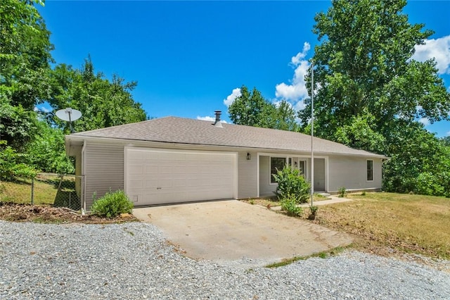 15654 Hickory Ln, Lowell, AR 72745 - ranch-style house with an attached garage and gravel driveway