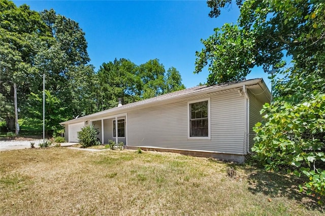 15654 Hickory Ln, Lowell, AR 72745 - view of front of home featuring a garage, a front lawn, and driveway