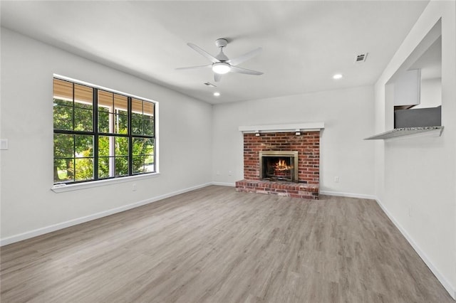 15654 Hickory Ln, Lowell, AR 72745 - unfurnished living room featuring ceiling fan, a brick fireplace, wood finished floors, and recessed lighting