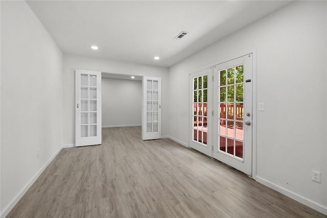 15654 Hickory Ln, Lowell, AR 72745 - empty room featuring french doors, wood finished floors, and recessed lighting