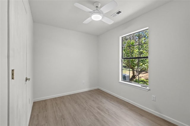 15654 Hickory Ln, Lowell, AR 72745 - empty room with wood finished floors and a ceiling fan
