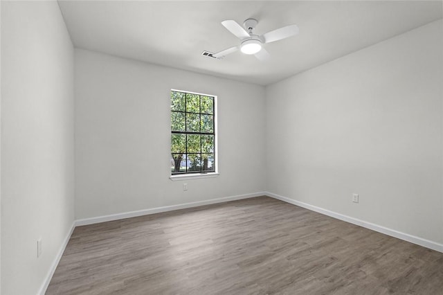 15654 Hickory Ln, Lowell, AR 72745 - spare room with wood finished floors and a ceiling fan