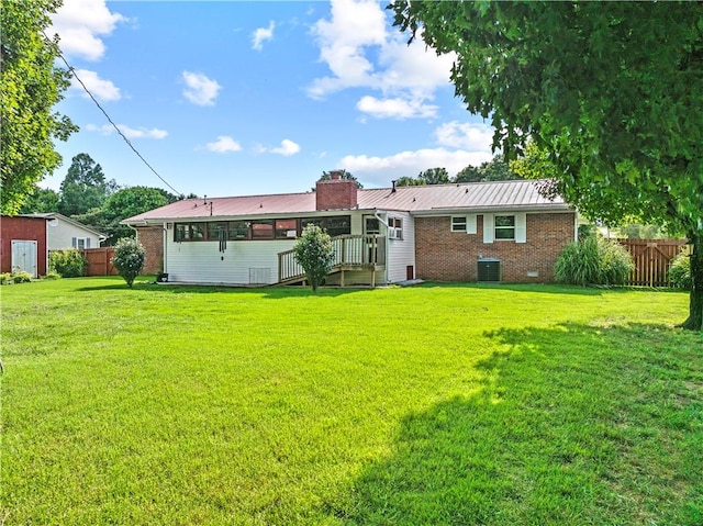 89 Creekview Rd, Harrison, AR 72601 - back of property featuring brick siding, a metal roof, and a chimney