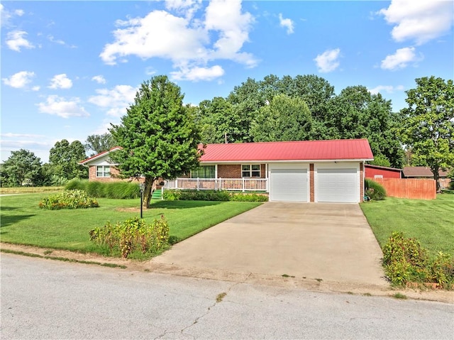 89 Creekview Rd, Harrison, AR 72601 - view of front of house with concrete driveway, a garage, a metal roof, and brick siding