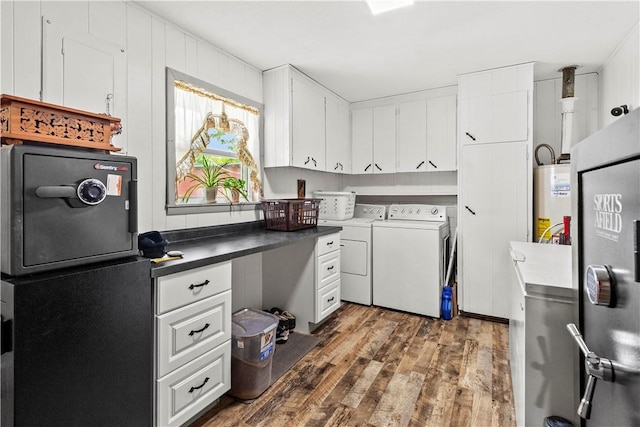 89 Creekview Rd, Harrison, AR 72601 - laundry area with washer and dryer, wood finished floors, and water heater