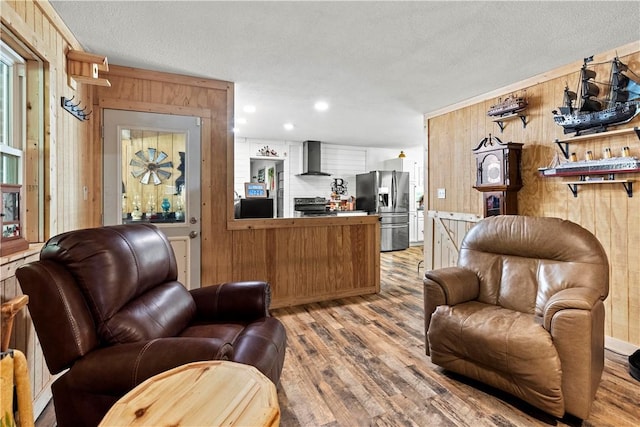 89 Creekview Rd, Harrison, AR 72601 - living room featuring wood walls, wood finished floors, a textured ceiling, and recessed lighting