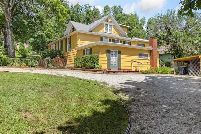625 W College Ave, Harrison, AR 72601 - view of front of house with a chimney, a front yard, and gravel driveway