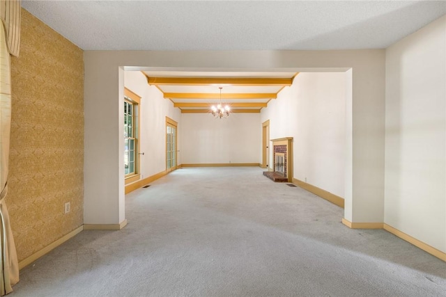 625 W College Ave, Harrison, AR 72601 - carpeted spare room featuring a chandelier and beam ceiling