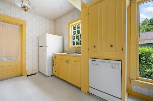 625 W College Ave, Harrison, AR 72601 - kitchen featuring wallpapered walls, white appliances, and light flooring